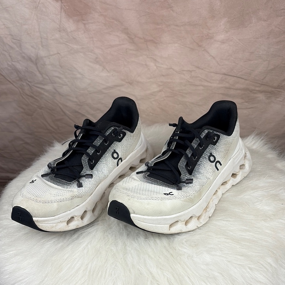 On Running Black and White Athletic Shoes with Cushioned Sole